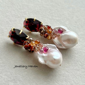 Lustrous iridescent white baroque pearls with garnet studs earrings